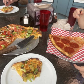 Gunnison Pizza Company - Small pizza half veggie half hamburger. In the side individual pepperoni slice. - Pizza Near Me - Gunnison, Colorado