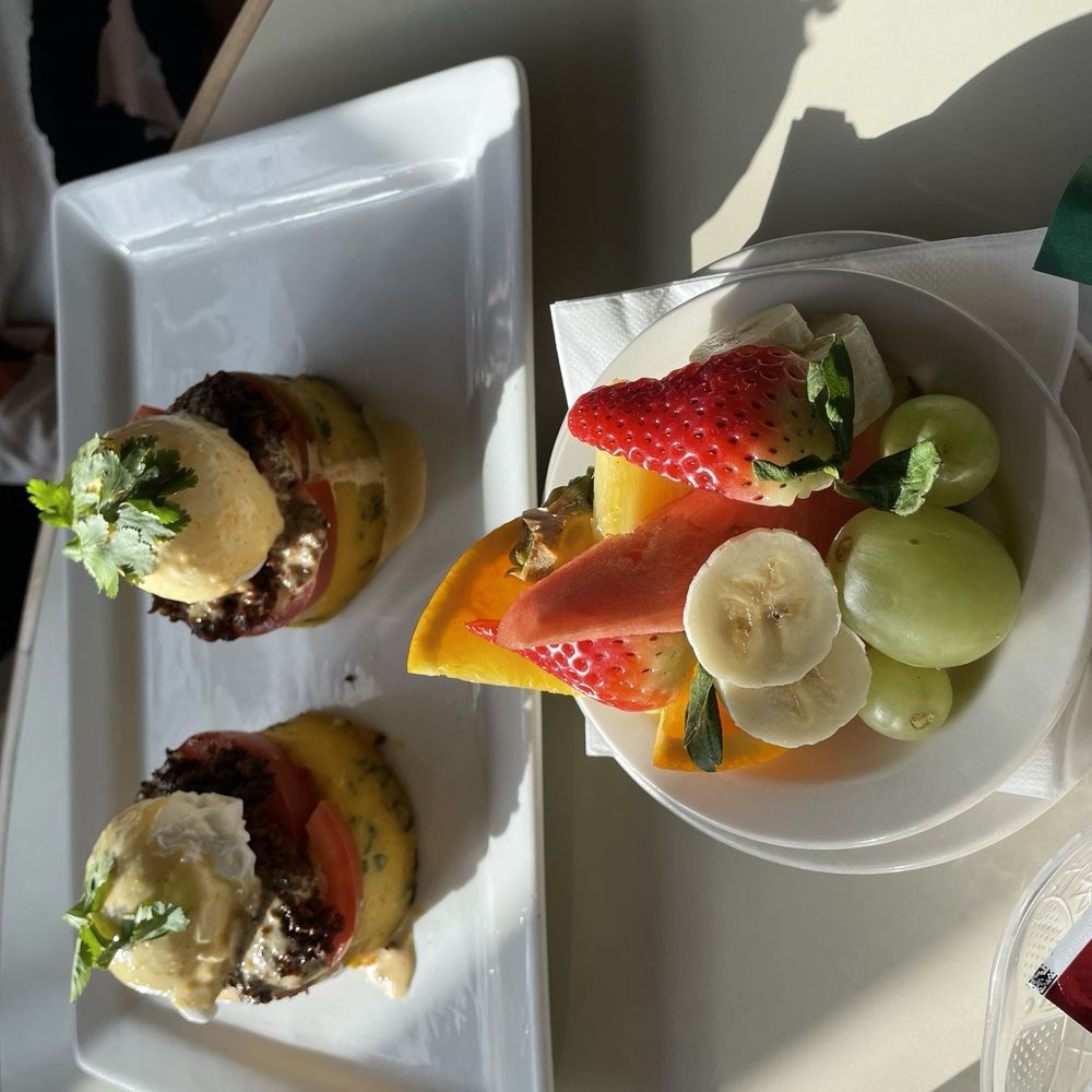 Savanna Restaurant Lakeview  - Llapingachos Benedict with fresh fruit side - Breakfast & Brunch Near Me - Chicago, Illinois