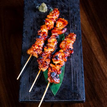 Madame Ushi - chicken skewers on a black plate - Sushi Bars Near Me - Aspen, Colorado