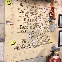 Price list on the wall, we paid $15 to fix a flat on a mid-sized car.