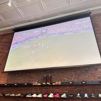 Darkalino's - Projector to watch the game and merchandise - Sandwiches Near Me - Seattle, Washington