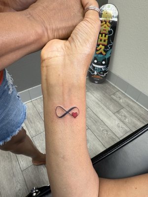 Adornment Piercing and Private Tattoo by null
