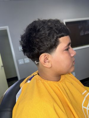 Kid's Haircuts - At Modern Edge Barbers, we offer precision cuts, clean fades, and expert beard grooming in a
stylish, upscale setting. We combine classic techniques with modern trends to deliver sharp,
personalized looks that keep you feeling confident and fresh.