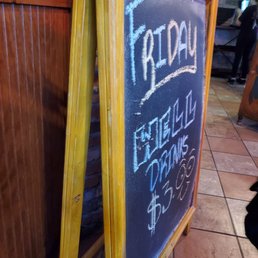 a chalk board with a sign that reads fritoup