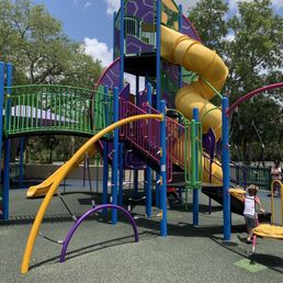 Three tall slides in a colorful area. Three tall slides in a colorful area.