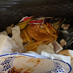 Classics Burgers And Moore - Beacon Cheeseburger in trash