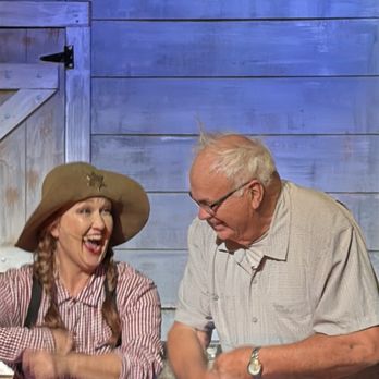 WhoDunnit Hoedown - The female deputy and an audience 'suspect' - Performing Arts Near Me - Branson, Missouri