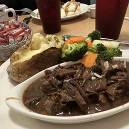 Pot Roast with baked potato and veggies. Pot Roast with baked potato and veggies.