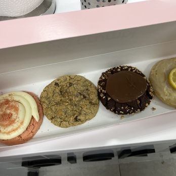 Crumbl - Fredericksburg - Left to right: Pink velvet, Moms recipe, Nutella hazelnut, lemon glaze. - Bakeries Near Me - Fredericksburg, Virginia Crumbl - Fredericksburg - Left to right: Pink velvet, Moms recipe, Nutella hazelnut, lemon glaze. - Bakeries Near Me - Fredericksburg, Virginia