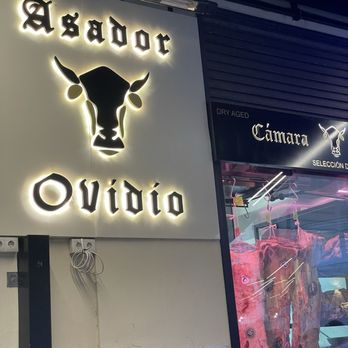Asador Ovidio - Entrance and patio area with display of aged meat. - Steakhouses Near Me - Málaga, Massachusetts Asador Ovidio - Entrance and patio area with display of aged meat. - Steakhouses Near Me - Málaga, Massachusetts