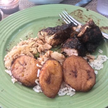 Fern Gully Jamaican Cafe - A partially eaten small jerk chicken plate, white rice, steamed vegetables and plantains. - Caribbean Near Me - Kennesaw, Georgia Fern Gully Jamaican Cafe - A partially eaten small jerk chicken plate, white rice, steamed vegetables and plantains. - Caribbean Near Me - Kennesaw, Georgia