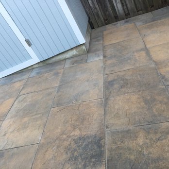 Rafael's Landscaping - a patio with a tile floor - Landscaping Near Me