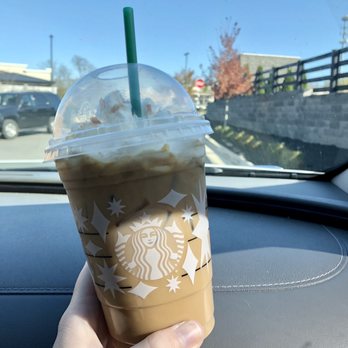 Starbucks - a hand holding a cup of iced coffee - Coffee & Tea Near Me - Georgetown, Kentucky