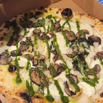 Bufalina Due - Mushroom pizza with side of chili flakes - Pizza Near Me - Austin, Texas Bufalina Due - Mushroom pizza with side of chili flakes - Pizza Near Me - Austin, Texas
