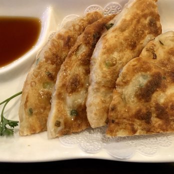 Yokohama Ramen - a plate of dumplings and a bowl of sauce - Ramen Near Me - Northampton, Massachusetts Yokohama Ramen - a plate of dumplings and a bowl of sauce - Ramen Near Me - Northampton, Massachusetts