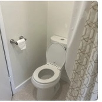 Skyline Construction Group - a white toilet in a bathroom - General Contractors Near Me Skyline Construction Group - a white toilet in a bathroom - General Contractors Near Me