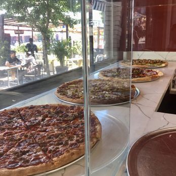 Fratelli Pizza - assorted pies in the window - Pizza Near Me - San Francisco, California Fratelli Pizza - assorted pies in the window - Pizza Near Me - San Francisco, California