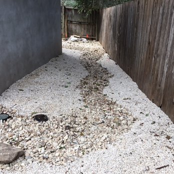 Austin Drainage + Landscape Development - 3/8" limestone rock, Colorado River Rock dry creek for drainage - Landscaping Near Me - Austin, Texas