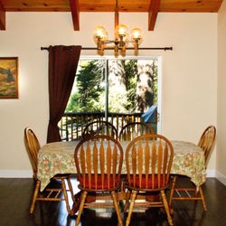 Cedar Ridge Retreat - Dining Room Looking Out on the BBQ Deck and Our Property Next Door. Forested Views.