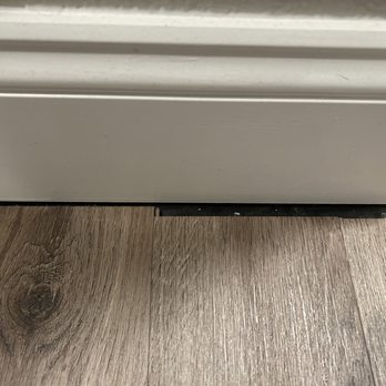 JR Flooring - Poorly cut flooring that was not hidden behind the baseboard - Flooring Near Me JR Flooring - Poorly cut flooring that was not hidden behind the baseboard - Flooring Near Me