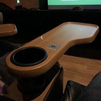 Regal Lynbrook - Respectable cup holder and tray attached to each seat. - Cinema Near Me - Lynbrook, New York
