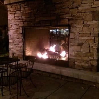 Kent Station - Outdoor fireplace in front of The RAM and beside Dilletante Mocha Cafe - Shopping Centers Near Me - Kent, Washington