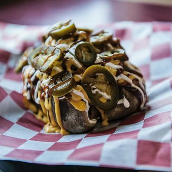 Deep South - Monster Potato......a huge potato smothered in pulled pork, cheese, sour cream, bbq sauce and jalapenos! - Pizza Near Me - McLeansboro, Illinois Deep South - Monster Potato......a huge potato smothered in pulled pork, cheese, sour cream, bbq sauce and jalapenos! - Pizza Near Me - McLeansboro, Illinois