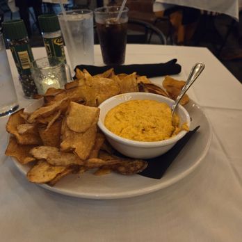 Sassafras Southern Bistro - Pimento cheese fondue with homemade potato chips. - Southern Near Me - Greenville, South Carolina Sassafras Southern Bistro - Pimento cheese fondue with homemade potato chips. - Southern Near Me - Greenville, South Carolina