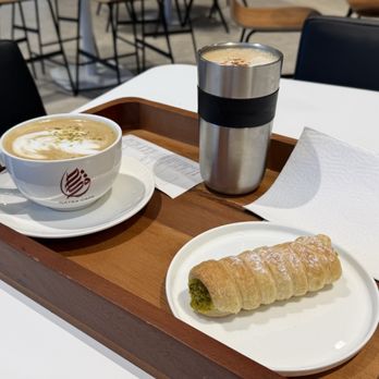 Qatra Cafe - Pistachio latte, biscoff latte in my cup, and a cream roll - Coffee & Tea Near Me - Pleasanton, California Qatra Cafe - Pistachio latte, biscoff latte in my cup, and a cream roll - Coffee & Tea Near Me - Pleasanton, California