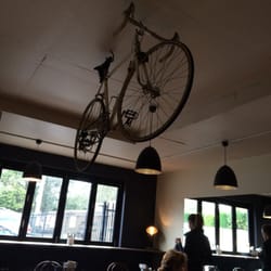 Stanley Street Cafe - Bike hanging from ceiling. This is a regular stop for cyclists!