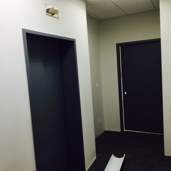 Emerald Painting & Renovation NYC - an empty room with a black door - Painters Near Me - Bronx, New York Emerald Painting & Renovation NYC - an empty room with a black door - Painters Near Me - Bronx, New York