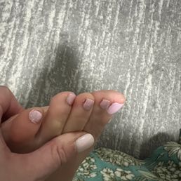 Middle toes have my old dark polish in the left corner. pinky toe (the one she did half of initially) has polish not cleaned up on my skin. Middle toes have my old dark polish in the left corner. pinky toe (the one she did half of initially) has polish not cleaned up on my skin.