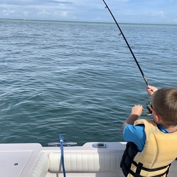 Island Time Charter - Q hooking into a catfish - Boat Charters Near Me Island Time Charter - Q hooking into a catfish - Boat Charters Near Me