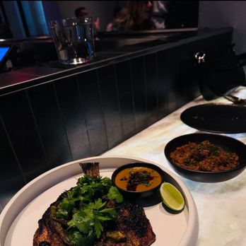 Dōgon - Branzino and jollof rice - Caribbean Near Me - Washington, DC, District of Columbia Dōgon - Branzino and jollof rice - Caribbean Near Me - Washington, DC, District of Columbia
