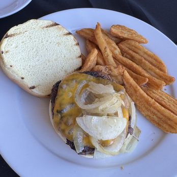 Vic's On the River - Sirloin burger ordered no garden added onions and cheddar - wedge fries - Seafood Near Me - Savannah, Georgia Vic's On the River - Sirloin burger ordered no garden added onions and cheddar - wedge fries - Seafood Near Me - Savannah, Georgia