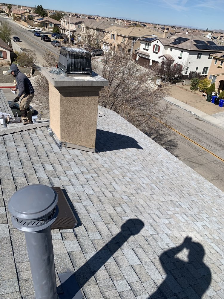 Slide of Ernestos Roofing