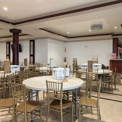 Mariscos La Palma  - Waiting on the linens to decorate the tables after the venue was late to open it door & after the wedding party, friends & family cleaned