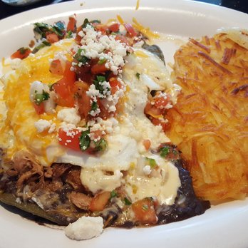 Baja Cafe on Campbell - Pulled Pork Heuvos Rancheros. Crispy blue corn tortillas topped with black bean sauce, pulled pork and two eggs over easy. Sooo good! - Breakfast & Brunch Near Me - Tucson, Arizona Baja Cafe on Campbell - Pulled Pork Heuvos Rancheros. Crispy blue corn tortillas topped with black bean sauce, pulled pork and two eggs over easy. Sooo good! - Breakfast & Brunch Near Me - Tucson, Arizona