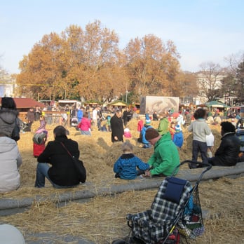 Adventmarkt Karlsplatz - kids playing with hay - Christmas Markets Near Me - Vienna, 9