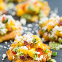 Abuela's Food Truck - "Tu no me tostone a mi!" Fried plantains with yellow a red peppers, red onions avocado and topped with shredded cheese!
