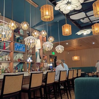 Bocca Osteria - I got a booth near the bar.  The lighting fixtures are cool.. Quiet an assortment!  But I like it. - Italian Near Me - Cooperstown, New York