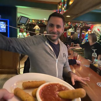 Connolly Station - My brother-in-law demonstrating an extraordinary cheese pull with these flavorful and satisfying mozzarella sticks!Lol - American Near Me - Malverne, New York Connolly Station - My brother-in-law demonstrating an extraordinary cheese pull with these flavorful and satisfying mozzarella sticks!Lol - American Near Me - Malverne, New York