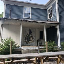 Kilbourne Market - Outdoor seating area, wall art.