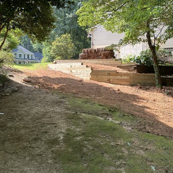 Venator Solutions - View of driveway retaining walls finished, and connected with older walls in back. - Landscaping Near Me Venator Solutions - View of driveway retaining walls finished, and connected with older walls in back. - Landscaping Near Me