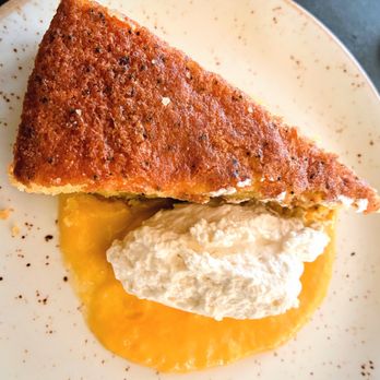 Big Sur Grill - Lemon Poppy Seed Cake on a bed of lemon curd and fresh whipped cream - American Near Me - Santa Monica, California Big Sur Grill - Lemon Poppy Seed Cake on a bed of lemon curd and fresh whipped cream - American Near Me - Santa Monica, California