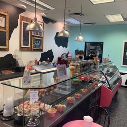 The ice cream bar is looking delicious. The staff is masked up. The ice cream bar is looking delicious. The staff is masked up.