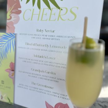 Peregrin - a glass of champagne and a menu - Bars Near Me - Savannah, Georgia