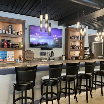 Granite View Market - a bar with stools and a flat screen tv - Beer, Wine & Spirits Near Me - Wausau, Wisconsin Granite View Market - a bar with stools and a flat screen tv - Beer, Wine & Spirits Near Me - Wausau, Wisconsin