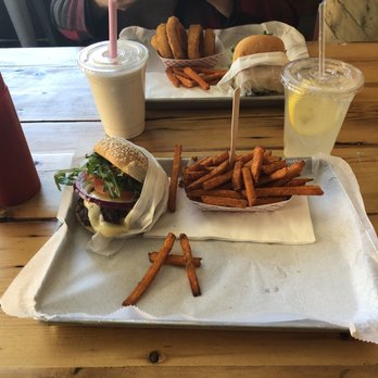 Milk Burger - Sriracha burger, Sweet potato fries, and fresh lemonade made perfect very chill spot laid back atmosphere I recommend this place to other. - Burgers Near Me - Bronx, New York