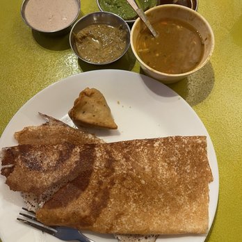 Curries & Biryanis - Plain Dosa and vegetable samosa, lintels, peanut chutney, coconut chutney, and I can't remember what the green one was called. - Buffets Near Me - Folsom, California